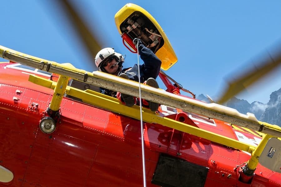 Rescue hoist operator at a helicopter door